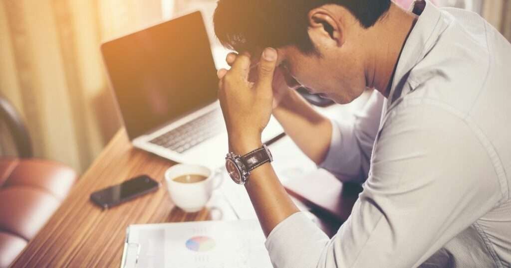 man stressed due to financial pressure